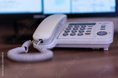 Fixed telephone mounted on the table