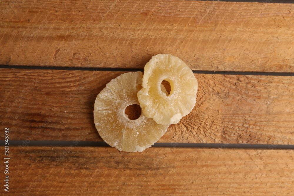 piece of dried pineapple fruit in color background piece of dried pineapple fruit in color background