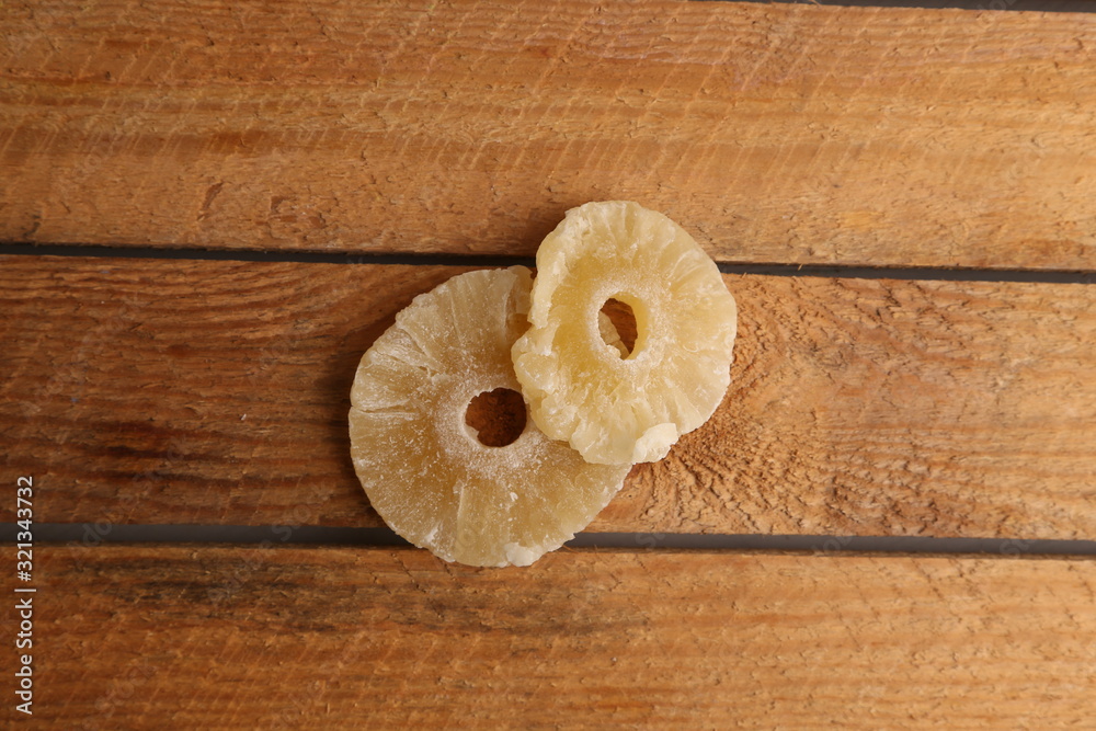 piece of dried pineapple fruit in color background