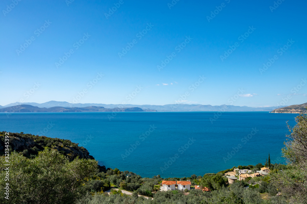 Relaxing colorful seascape with view on mountains of Peloponnese, Greece
