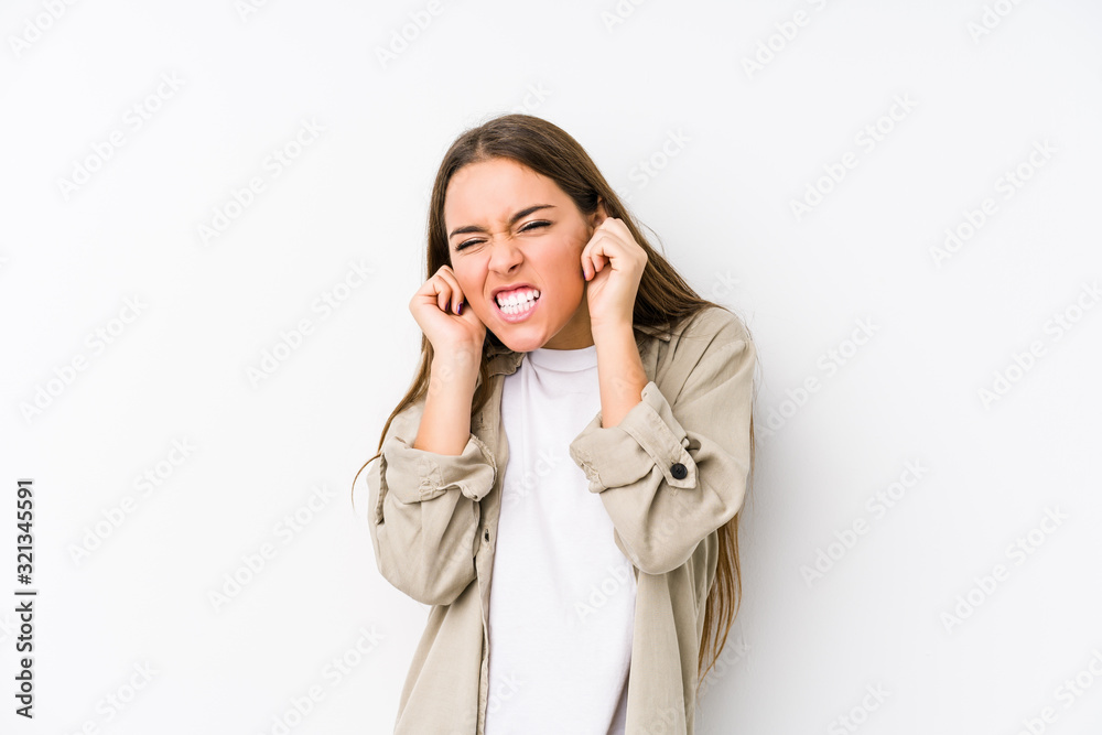 Young caucasian woman isolated covering ears with hands. Young caucasian woman isolated covering ears with hands.