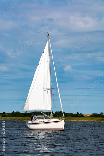 Weekend sailing on small jacht boat on riviers and canals in South Holland, Kaag, Netherlands