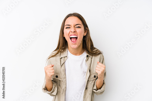 Young caucasian woman  isolated cheering carefree and excited. Victory concept.