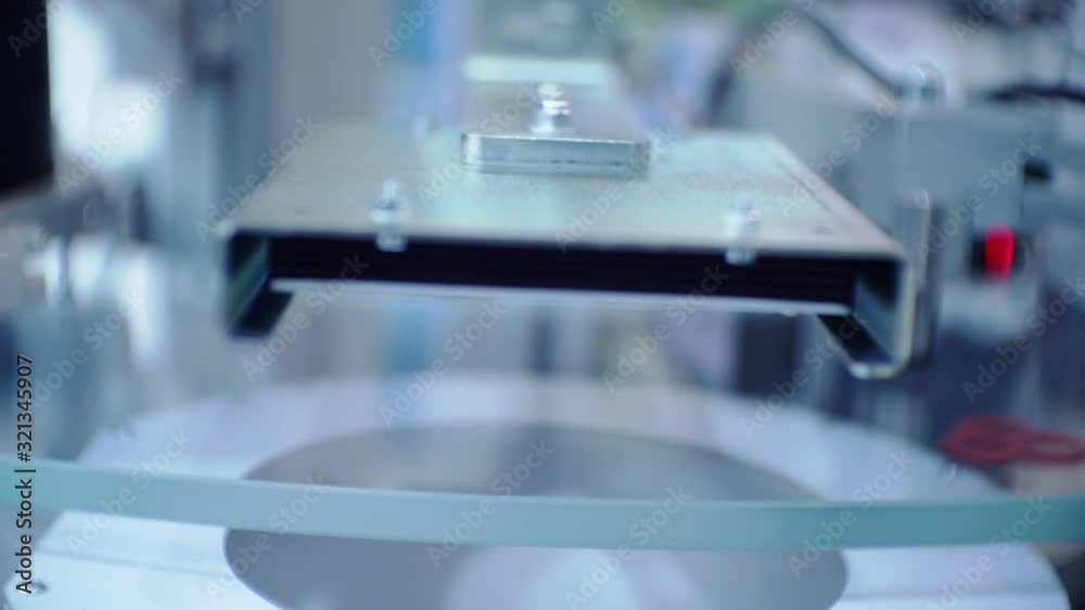 finished plastic parts are moving on a conveyor finished plastic parts are moving on a conveyor