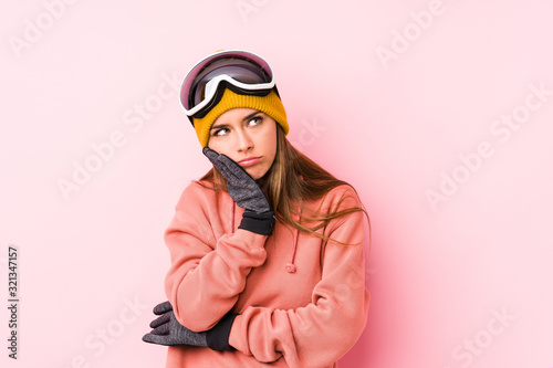 Young caucasian woman wearing a ski clothes isolated who is bored, fatigued and need a relax day.