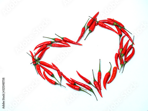 heart sign of red chili peppers on a white background. blank for designers. free space for text