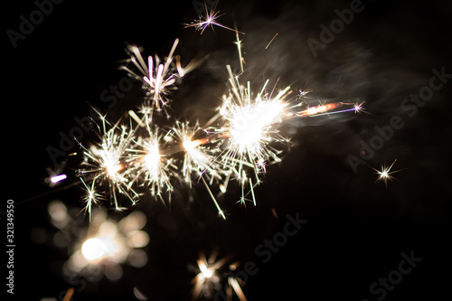 Sparkler burning in the dark during New Years night celebration 