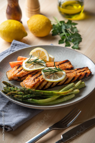 grilled salmon fillet on plate with asparagus