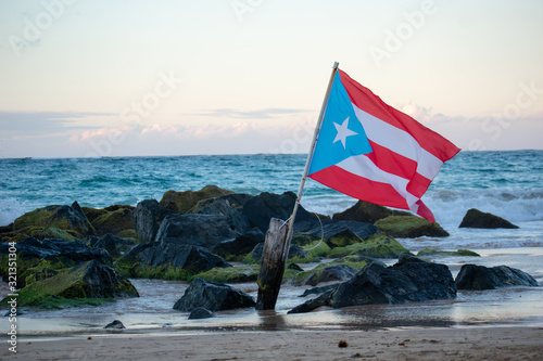 Puerto Rican Flag Blowing in the Wind at the Beach photo