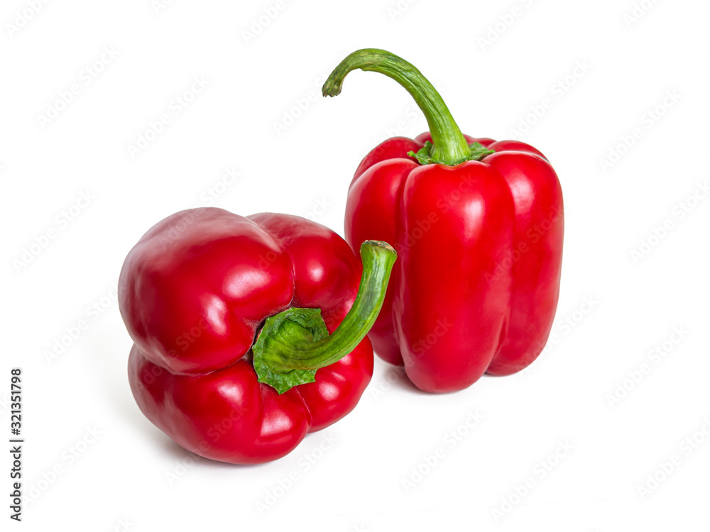 Two bright red sweet bell peppers on a white background Two bright red sweet bell peppers on a white background