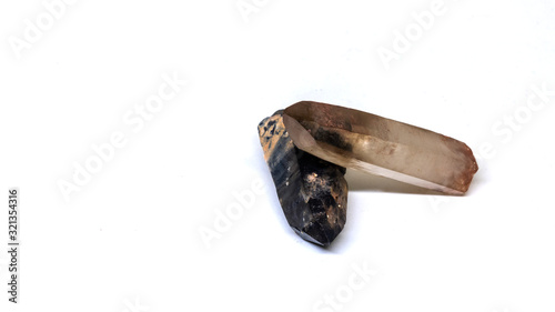 Power stones. Black morion and rauchtopaz. Close-up isolated on a white background. Mystical and esoteric concept.