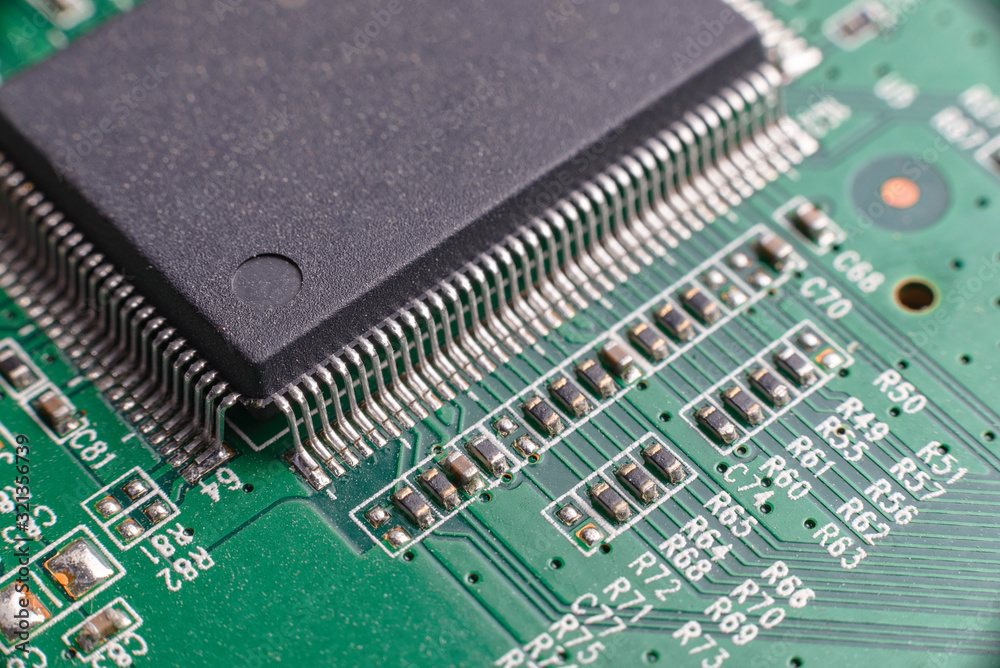 Green printed electronic circuit board having small electronic components and chips. Green printed electronic circuit board having small electronic components and chips.