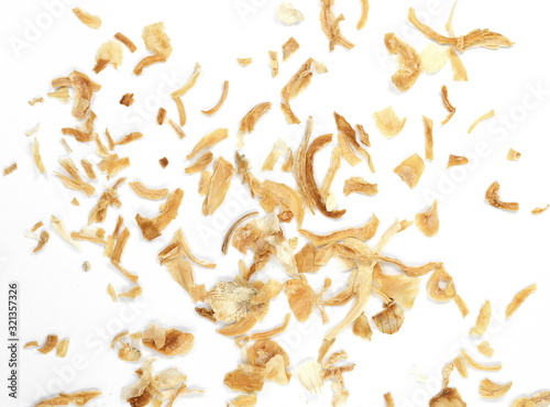 Dried Minced Onions on a White Background. Onion flakes isolated on white background.