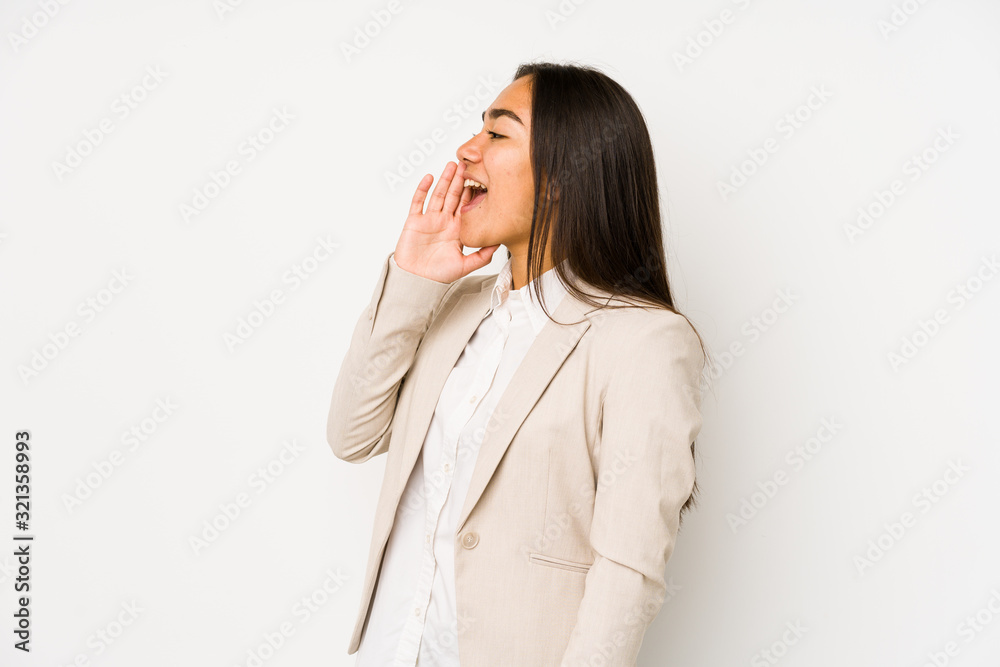 Young woman isolated on a white background shouting and holding palm near opened mouth. Young woman isolated on a white background shouting and holding palm near opened mouth.
