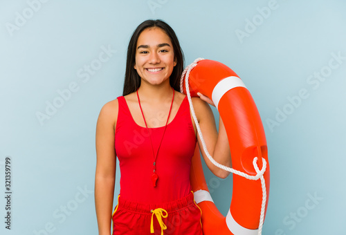 Young asian lifeguard woman isolated happy, smiling and cheerful.