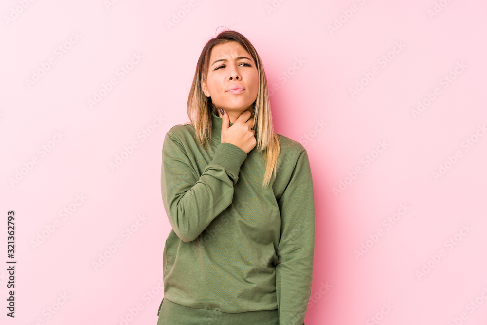 Young caucasian woman posing isolated  suffers pain in throat due a virus or infection.