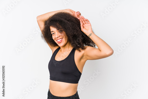 Wallpaper Mural Young african american sporty woman stretching arms, relaxed position. Torontodigital.ca