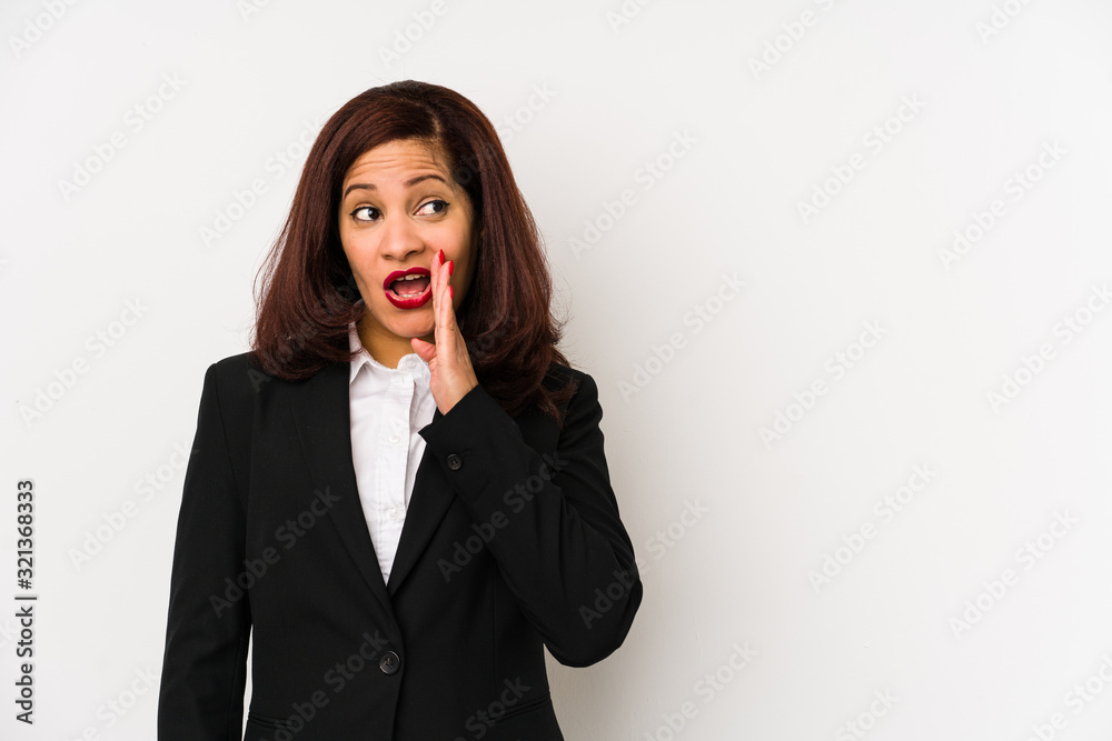 Middle age latin business woman isolated is saying a secret hot braking news and looking aside Middle age latin business woman isolated is saying a secret hot braking news and looking aside