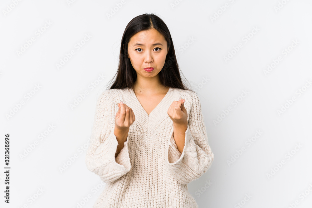 Young chinese woman isolated showing that she has no money. Young chinese woman isolated showing that she has no money.