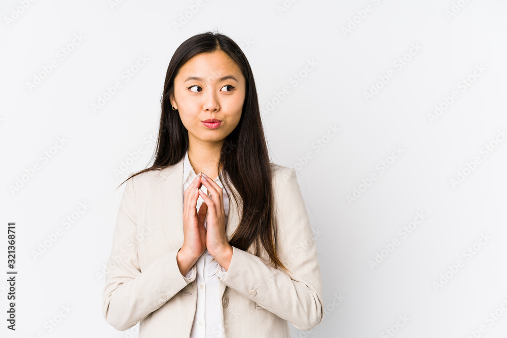 Young business chinese woman isolated making up plan in mind, setting up an idea. Young business chinese woman isolated making up plan in mind, setting up an idea.