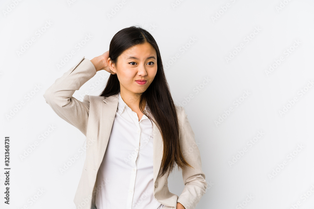 Young business chinese woman isolated touching back of head, thinking and making a choice. Young business chinese woman isolated touching back of head, thinking and making a choice.
