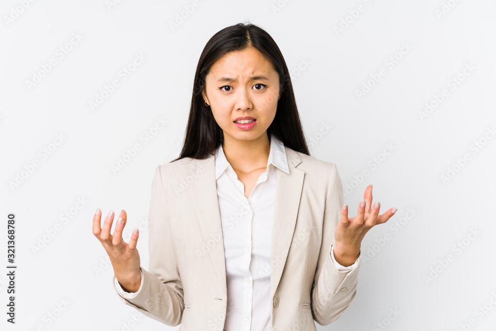 Young chinese business woman isolated screaming with rage. Young chinese business woman isolated screaming with rage.