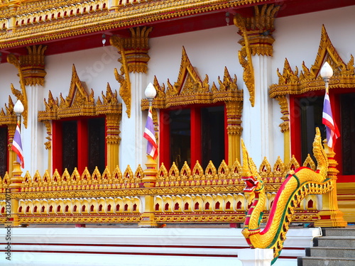 Wat Nong Wang in Khon Kaen Essan Thailand a temple with 9 golden levels and Payanak surrounding the exterior photo