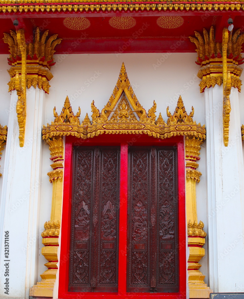 Fototapeta premium Wat Nong Wang in Khon Kaen Essan Thailand a temple with 9 golden levels and Payanak surrounding the exterior