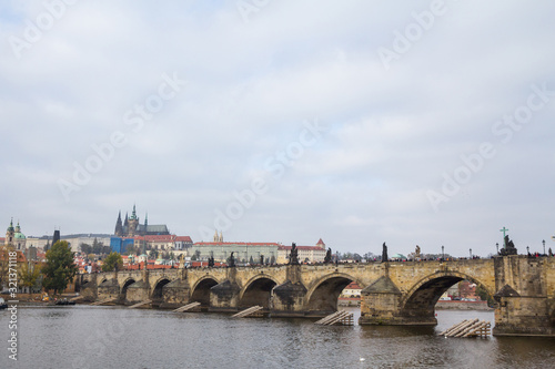 Panorama of the Old Town of Prague, Czech Republic, with a focus on Charles bridge (Karluv Most) and the Prague Castle (Prazsky hrad) seen from the Vltava river. 
