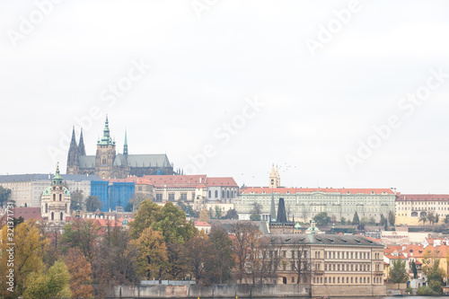 Panorama of the Old Town of Prague  Czech Republic  with a focus on Hradcany hill and the Prague Castle with the St Vitus Cathedral  Prazsky hill  seen from the Vltava river. 