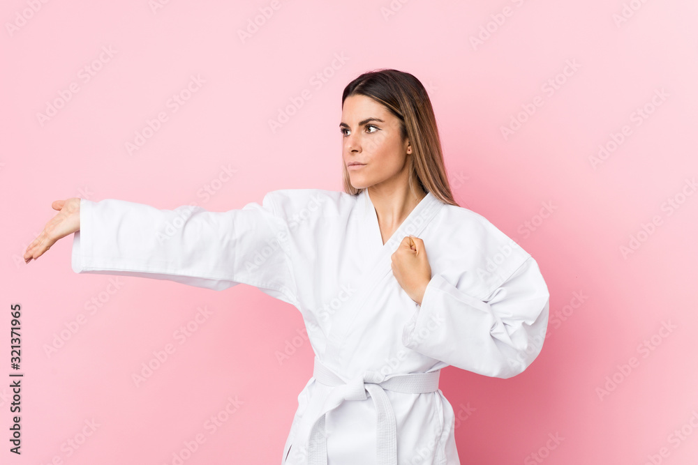 Young caucasian karate woman isolated Young caucasian karate woman isolated
