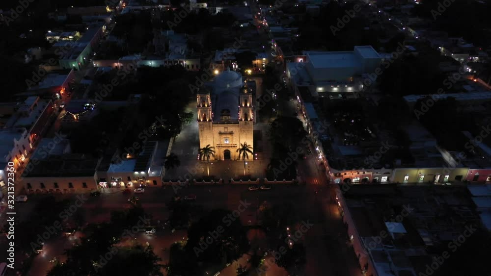 High night time aerial pull back and camera pitch up in front of Cathedral de San Gervasio in Valladolid, Yucatan, Mexico. High night time aerial pull back and camera pitch up in front of Cathedral de San Gervasio in Valladolid, Yucatan, Mexico.