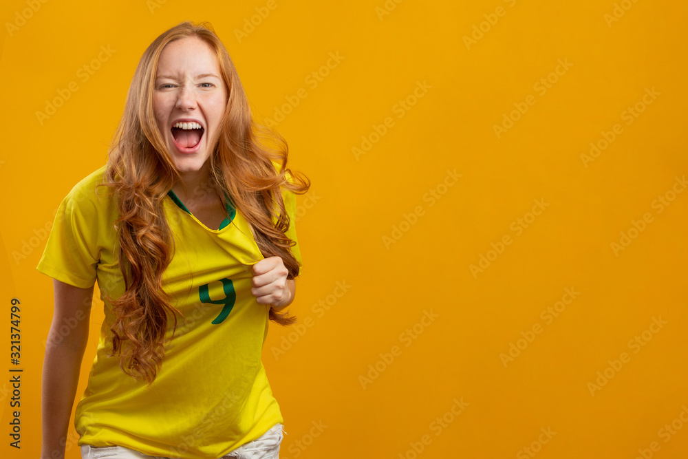 Premium Photo  Brazilian supporter. brazilian woman fan celebrating on  soccer or football match on yellow background. brazil colors.