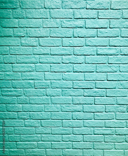 Blue aqua stone brick block pattern wall spray painted texture concrete background in retro style with copy space