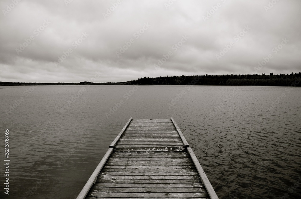 old wooden pier on the lake in black and white - Laurie lake - duck mountain provincial park - Manitoba old wooden pier on the lake in black and white - Laurie lake - duck mountain provincial park - Manitoba