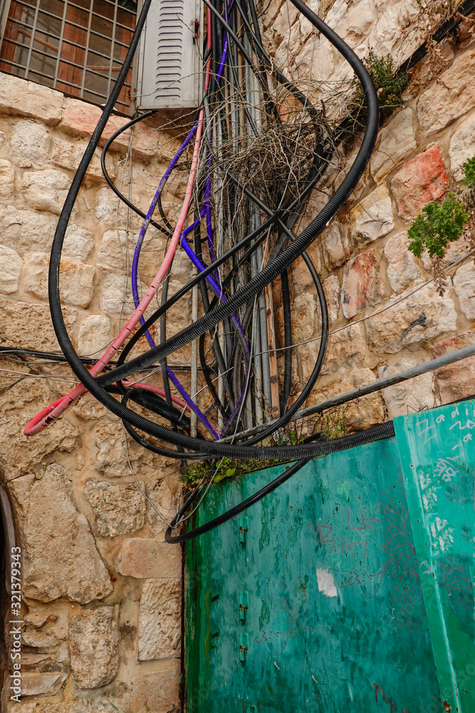 Jerusalem, Israel Electricity cables leading into an outdoor box.