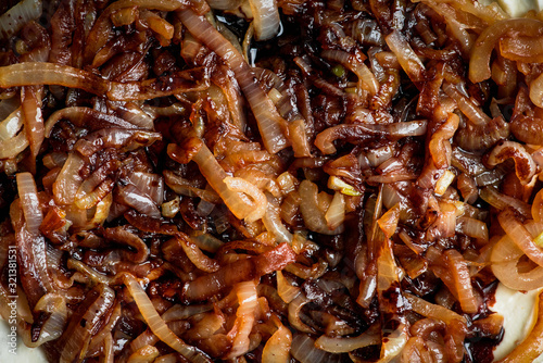 Photos Homemade pizza with goat cheese, caramelized onion and balsamic vinegar