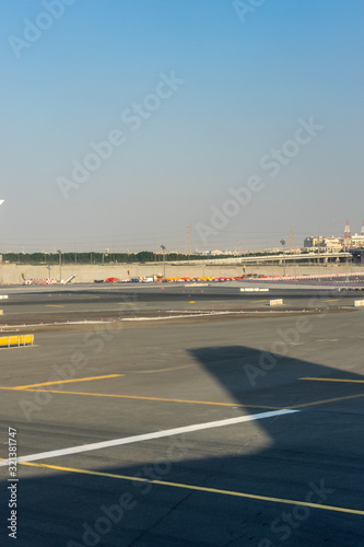Dubai Emirates  a large air plane on a runway at an airport