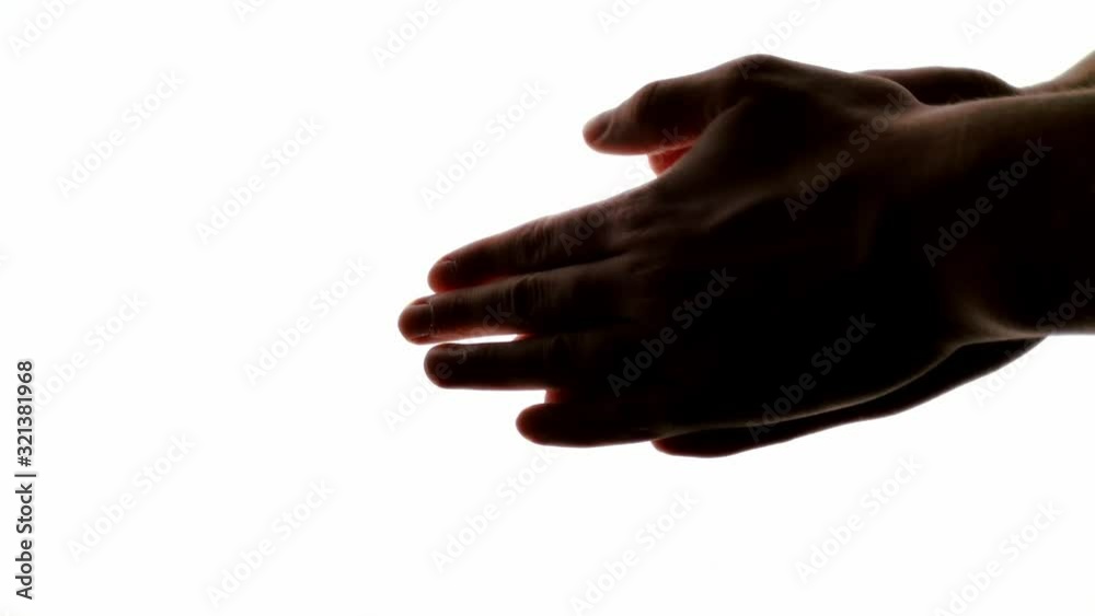 Anonymous hands rubbing together quickly to generate heat in order to warm them up Anonymous hands rubbing together quickly to generate heat in order to warm them up