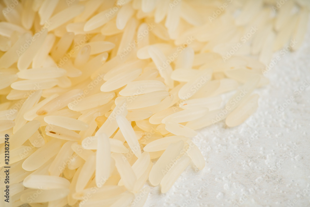 Raw rice on the kitchen table. Selective focus. shallow depth of field. Raw rice on the kitchen table. Selective focus. shallow depth of field.