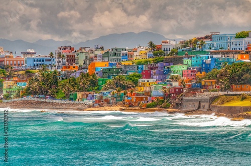 Colorful houses line the hillside over looking the beach in San Juan, Puerto Rico