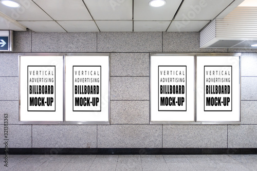 Mock up blank vertical billboard on the wall at subway