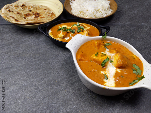 Top down view of Paneer Butter Masala , a rich and creamy Indian dish made of Paneer or Tofu in tomato and cream gravy.