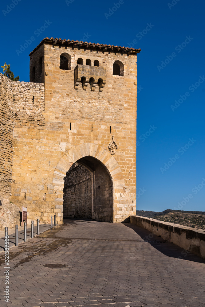 Porta Sant Mateu one of the city wall gates of Morella with Romanesque windows and Gothic arch way in Spain