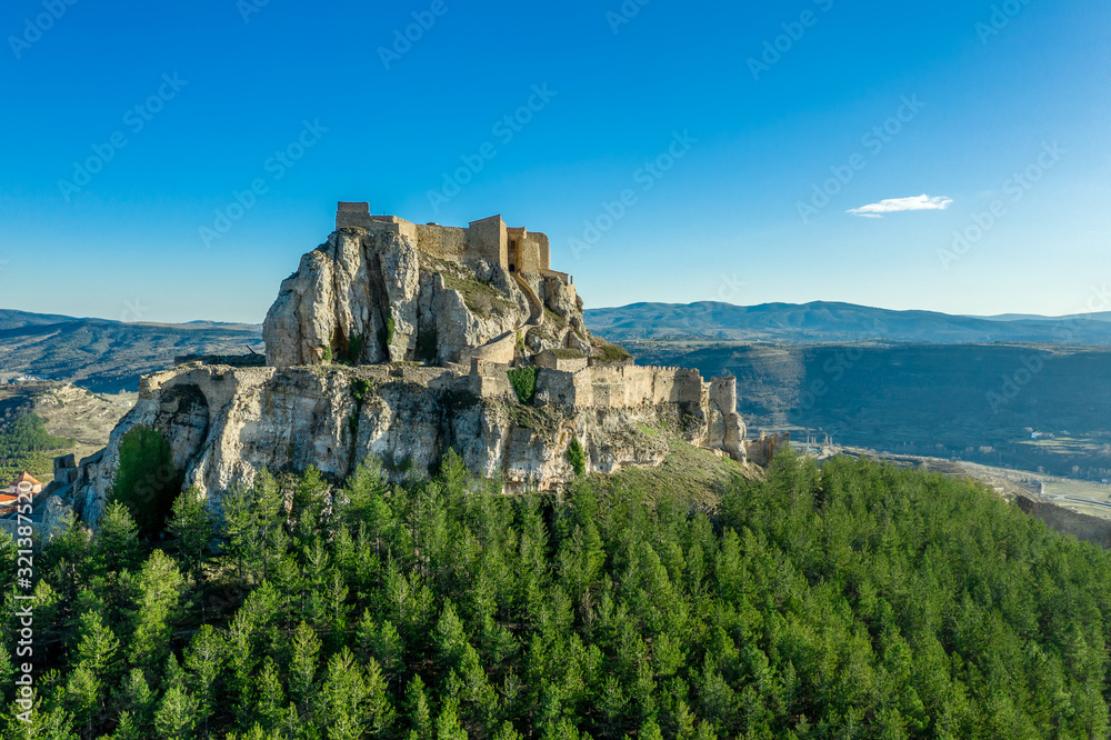 Aerial view of the fortress above Morella Spain with large pine trees