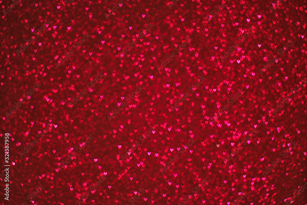 St. Valentine's Day red heart bokeh background. Red abstract glitter unfocused background with heart-shaped bokeh sequins. St. Valentine's Day red heart bokeh background. Red abstract glitter unfocused background with heart-shaped bokeh sequins.