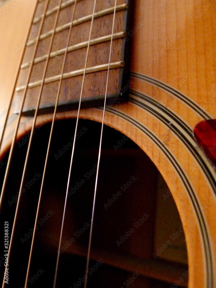 Obraz premium Close-up of guitar strings and soundhole