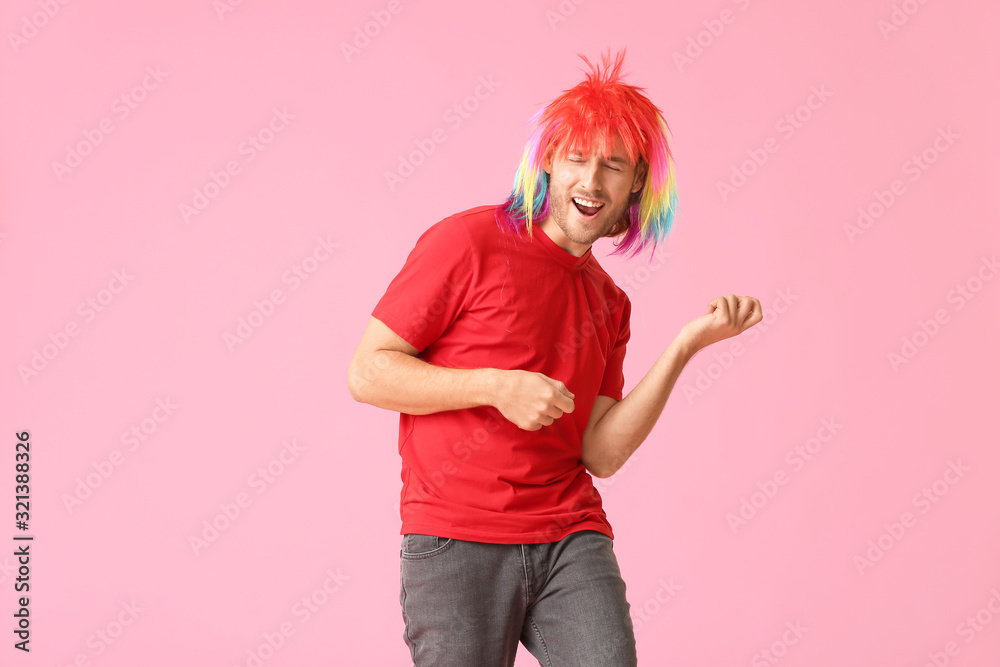 Man in funny disguise on color background. April fools' day celebration Man in funny disguise on color background. April fools' day celebration