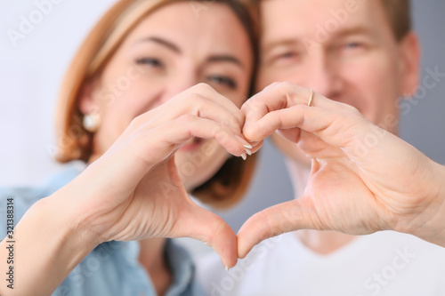 Beautiful couple holding ha...