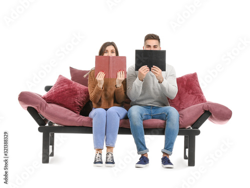 Young couple reading books ...